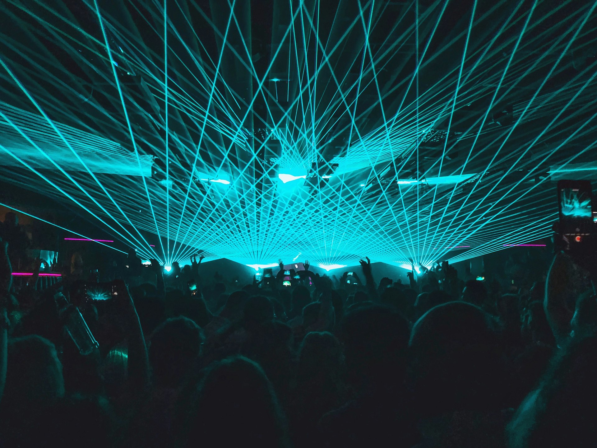 Laser lights over a club crowd in Ibiza